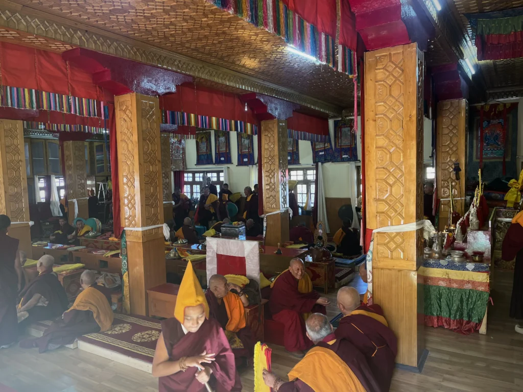Monks inside Diskit Monastery prepare for the sacred Cham dance.